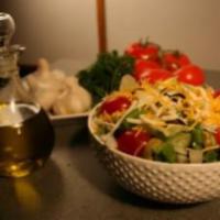 Greek Salad · House salad with feta cheese and Italian dressing.