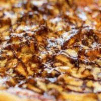 Large BBQ Chicken Pizza · Our homemade sauce, topped with our tasty, tangy BBQ chicken and sauce.