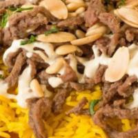 Beef shawarma fata  · Beef shawarma over rice with Nuts garlic bread and  baba ghanouj