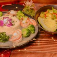 Garlic Shrimps · Sauteed garlic shrimps in white wine sauce accompanied with white rice, broccoli & small man...