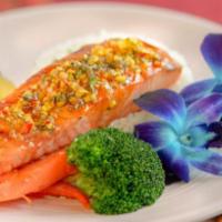 Grilled Salmon · Grilled salmon served with sauteed carrots, broccoli, & rice
(Salmon a la parrilla acompañad...
