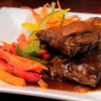 #2. Brown Stew Chicken Meal · Comes with rice & salad 