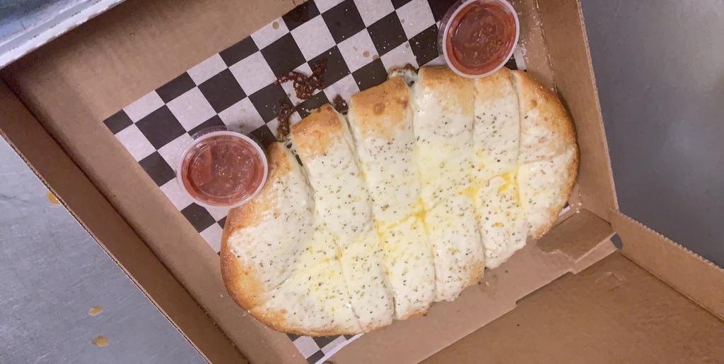 Garlic Cheese Breadsticks with Marinara · One pound of pizza dough baked crisp and topped with garlic butter and fresh mozzarella cheese. Served with marinera on the side