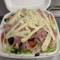Antipasto Salad · Comes with crisp salad greens topped tomatoes, onions, green peppers, black olives, ham, sal...