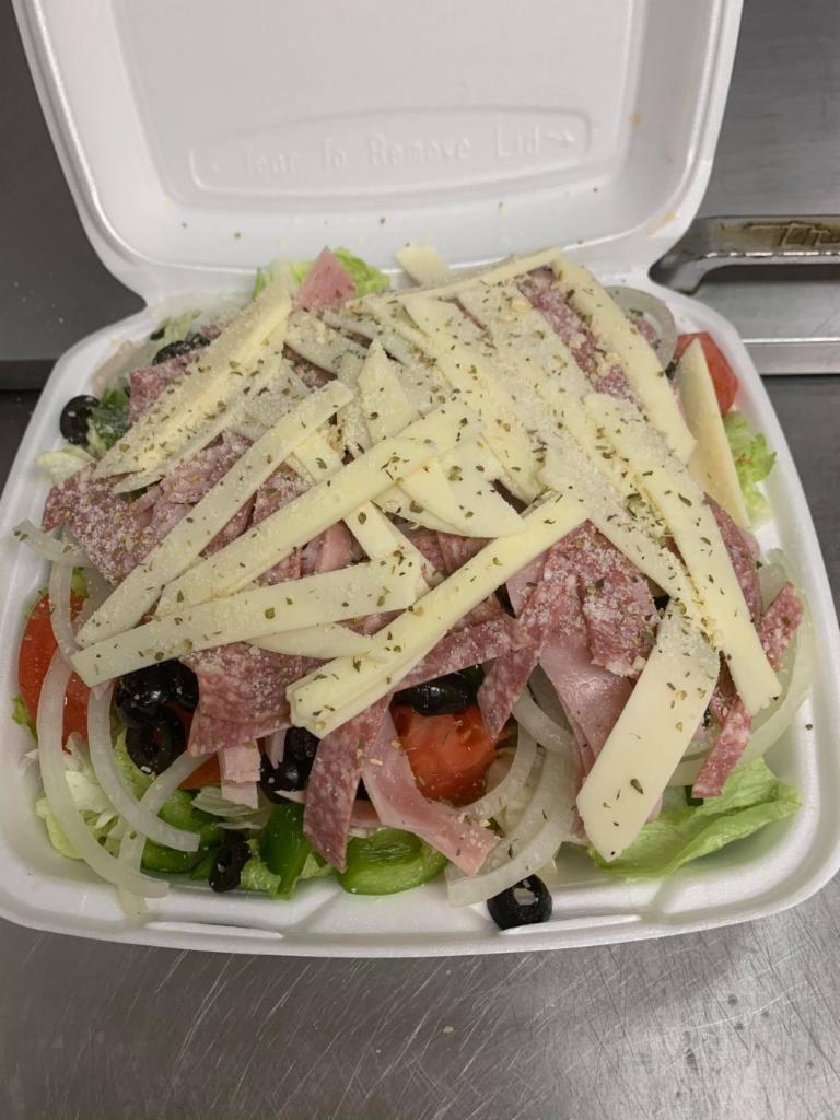 Antipasto Salad · Comes with crisp salad greens topped tomatoes, onions, green peppers, black olives, ham, salami, provolone, Parmigiana cheese and oregano.