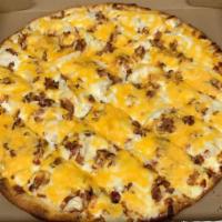 Potato Pizza · A thin layer of sour cream topped with sliced potatoes, Vidalia onions, bacon and cheddar ch...