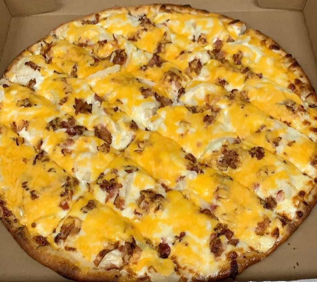 Potato Pizza · A thin layer of sour cream topped with sliced potatoes, Vidalia onions, bacon and cheddar cheese.