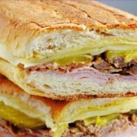 Cuban Sandwich · Ham, Roasted Pork & Swiss Cheese w/ Pickles & Spicy Mustard.