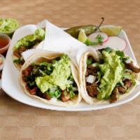 Carne Asada Taco · Grilled beef  with cilantro, onion, guacamole side with lemon ,jalapeno,radish