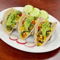 10. Vegetariano Taco · Corn, green, red peppers and mushrooms. Served with cilantro, onions and guacamole.