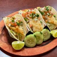 13. Pescado Taco · Fish. Served with lettuce, pico de gallo and guacamole.