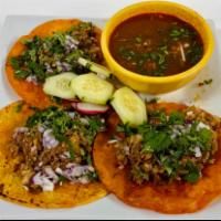 Tacos de Birria · 3 tacos de birria , cliantro and cebolla with a consome de birria / beef stew on the side