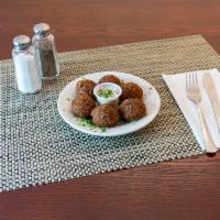 Falafel · Seasoned mixture of ground chickpeas and fried into patties.