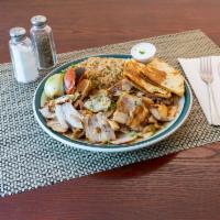 Chicken Shawarma platter · Chicken seasoned on a rotating spit and served with garlic sauce.