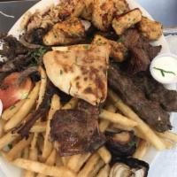 Super Mixed Grilled · 2 skewers of chicken kafta, 2 skewers of beef kafta, one shish tawook and one beef shish keb...