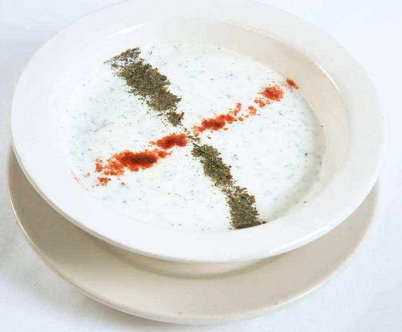 Cacik · Homemade yogurt mixed with chopped cucumber, mint and dill.