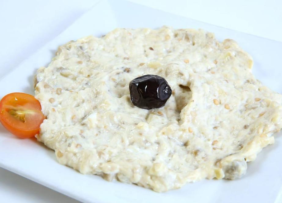 Baba Ghanoush · Smoked eggplant puree, olive oil, tahini sauce, herbs and spices.