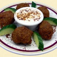 Falafel Appetizer · Deep fried chickpeas and vegetables blended with Middle Eastern spices.