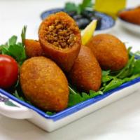 Kibbeh · 2 pieces.  Wheat bulgur stuffed with seasoned ground lamb and pine nuts.