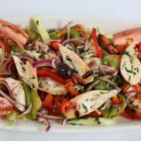 Octopus Salad · Grilled octopus, mixed greens, tomatoes, onions, green bell peppers, olive oil and lemon jui...