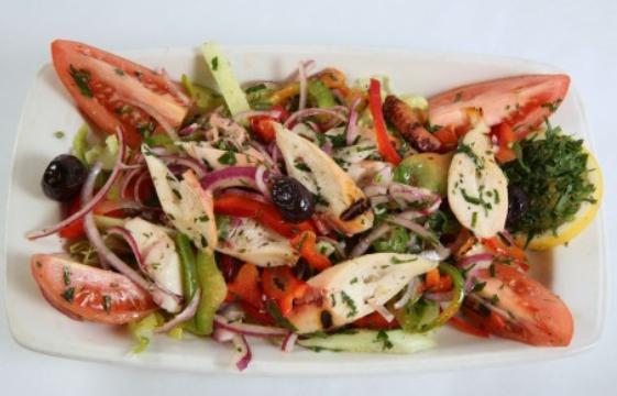 Octopus Salad · Grilled octopus, mixed greens, tomatoes, onions, green bell peppers, olive oil and lemon juice.