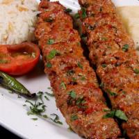 Adana Kebab · Slightly seasoned hand chopped lamb, flavored with red bell peppers and grilled on skewers. ...
