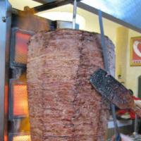 Doner Kebab  (Homemade Gyro)   · Beef and Lamb Breast marinated with chef’s own secret blend of seasoning, cooked on a rotati...