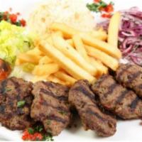 Meatballs Kasap Kofte · Mixture of ground beef and lamb, seasoned with peppers, tomatoes and special herbs. Served w...