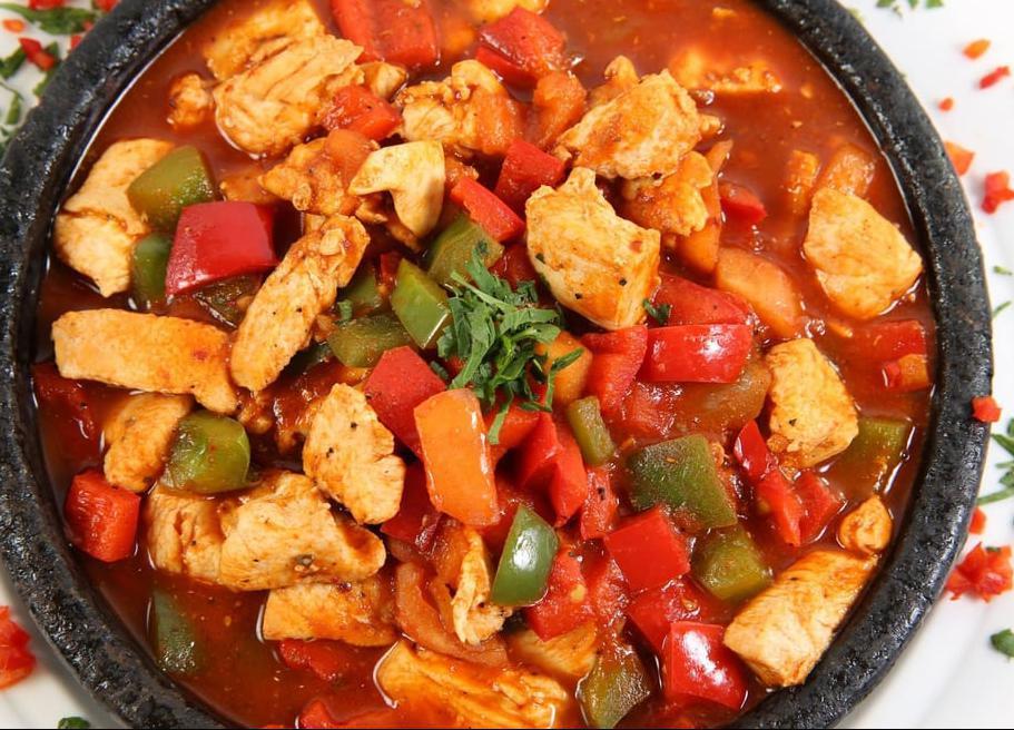 Chicken Sautee · A delicate combination of chicken breast, onions, greens, red peppers, tomatoes and garlic, sauteed in butter. Served with rice.