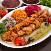 Chicken Shish · Tender chunks of chicken, marinated with chef's own blend of herbs and spices. Served with r...