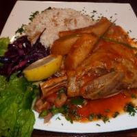 Lamb Shank  Chef's Specials · Baked lamb shank wrapped in sliced eggplant.  Served with rice. 