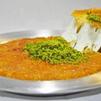 Home made Kunefe  · Shredded dough layered with sweet kunefe cheese. Served with honey syrup and pistachio toppi...