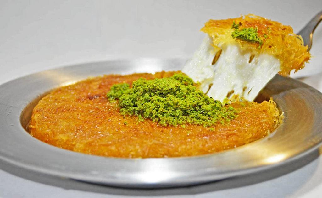 Home made Kunefe  · Shredded dough layered with sweet kunefe cheese. Served with honey syrup and pistachio topping.
