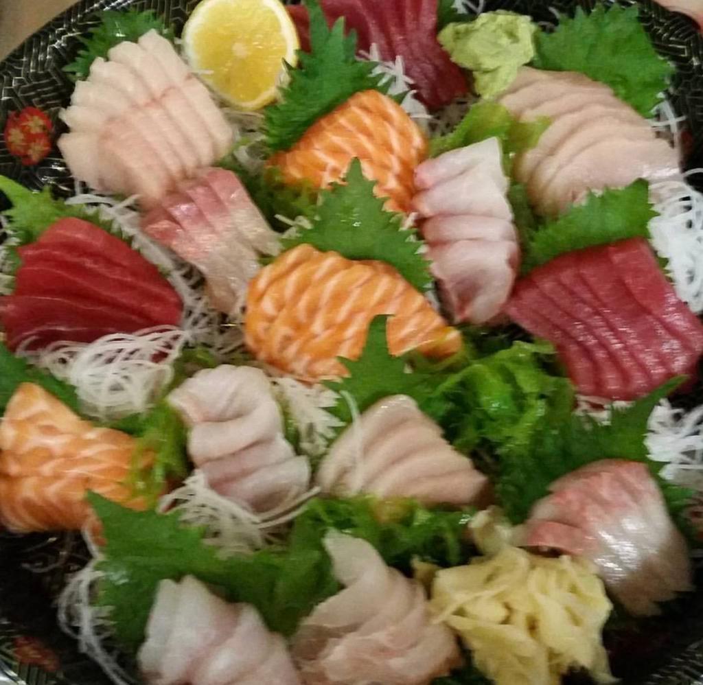 H. Sashimi Platter · Includes 16 pieces tuna, 16 pieces salmon, 16 pieces yellowtail, 8 pieces yellowtail belly, 8 pieces eel, 8 piece salmon belly and 8 pieces striped bass.