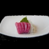 Tuna Sashimi · Maguro. Slices of raw fish and rice less.