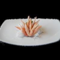 Snow Crab Sashimi · Kani. Slices of raw fish and rice less.