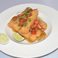 Crispy Fish · Fried fish sticks served with fried green plantains topped with Peruvian chalaca (cherry tom...