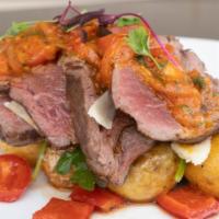 Caracas Fillet Mignon · Seared and sliced beef tenderloin (8 oz) with tomatoes cherries, red onions, garlic and cila...
