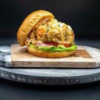 33RD and Main Colossal Seafood Burger · Jumbo lump crab meat and shrimp blended with savory seasonings served on a toasted Duke's br...