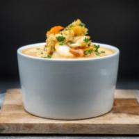 The Lake Norman Crab Bisque · Savory cream of crab bisque with a splash of sherry wine, lump crab meat, shrimp and seasoni...