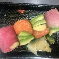 Rainbow · Crab and avocado roll topped with tuna, salmon, yellowtail and avocado.