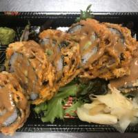 The Tree Hugger · Inari tofu, avocado, and cucumber roll flash-fried in a tempura carrot breading topped with ...