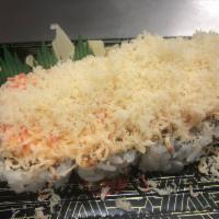 Dynamite · Shrimp tempura roll topped with baked crab salad and crunchy flakes.