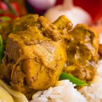 Curried Chicken · Tender chunks of curry-clad chicken cooked to the bone. Includes potatoes and carrots for a ...