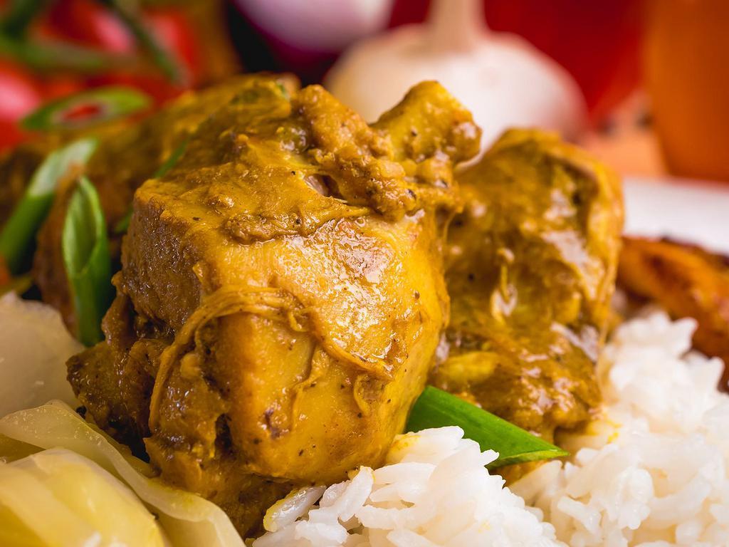 Curried Chicken · Tender chunks of curry-clad chicken cooked to the bone. Includes potatoes and carrots for a hearty anytime meal.