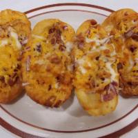 Potato Skins · 4 baked potato loaded with bacon, sour cream, red onion, and shredded cheddar cheese.