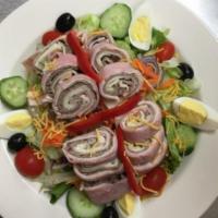 Chef Salad · Served with ham, turkey, roast beef, and Swiss cheese wrapped and sliced over garden salad.