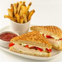 Grilled Chicken Panini · Marinated grilled chicken breast with olive tapenade, fresh mozzarella, tomatoes, basil and ...