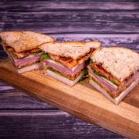Mile High Club Sandwich · Smoked turkey, ham, and bacon with Swiss and American cheese, lettuce and tomato. Served on ...