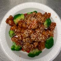 S6. Sesame Chicken · Served in a sweet sauce served with sesame seeds.